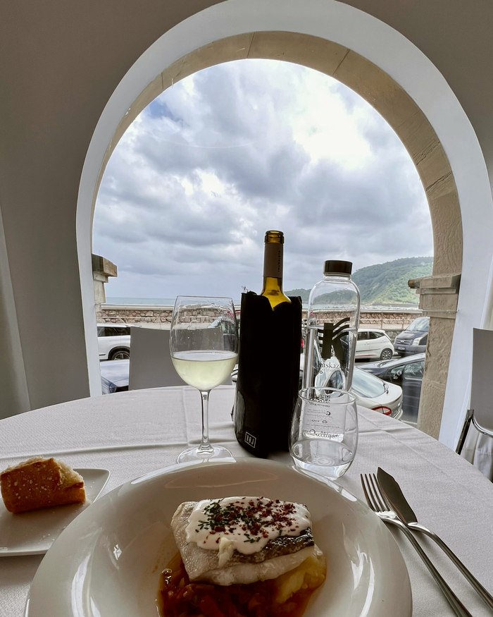 A table with a view through an arch
