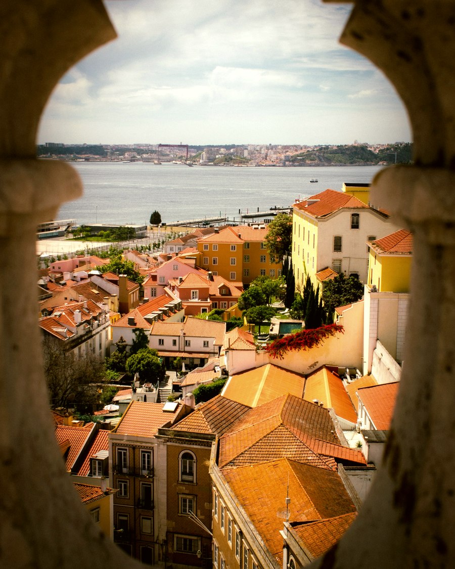 Rooftops seen through a stone opening