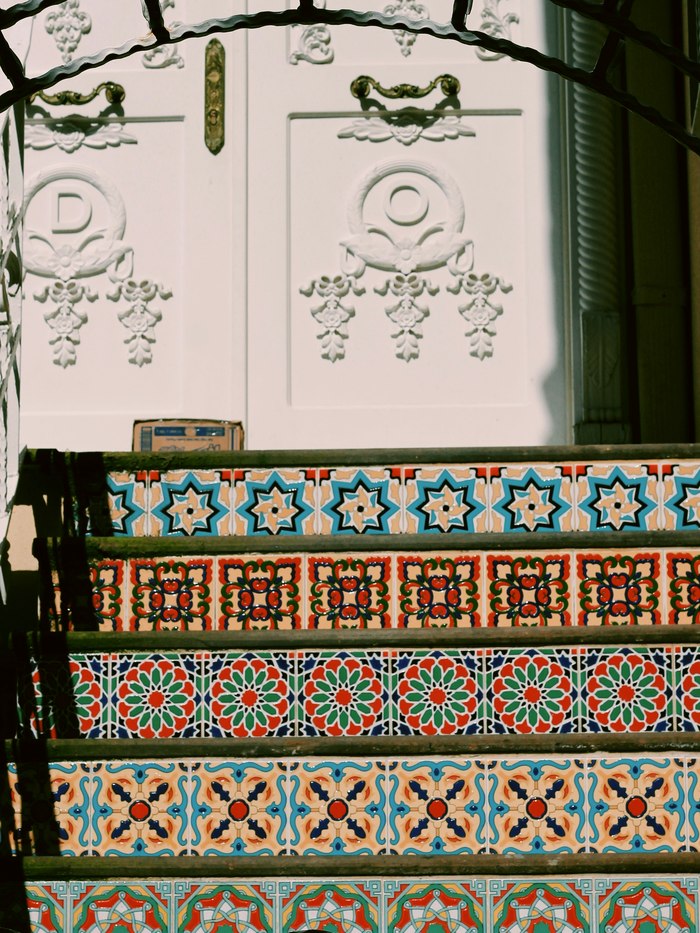 Tiled steps and a white door